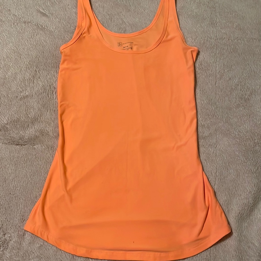 Plain orange No Boundaries tank top.